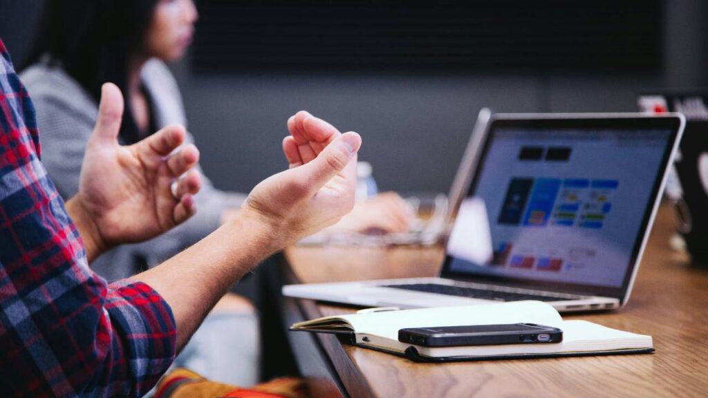 Man using hand gestures to explain something at a business meeting