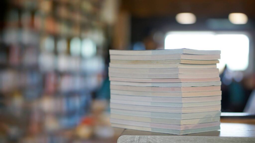 Several textbooks stacked upon each other