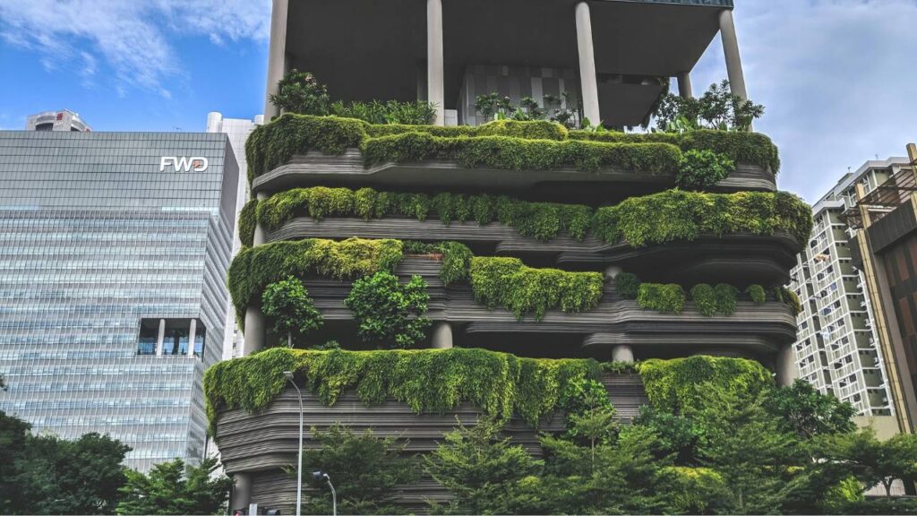 A modern building with lots of greenery 