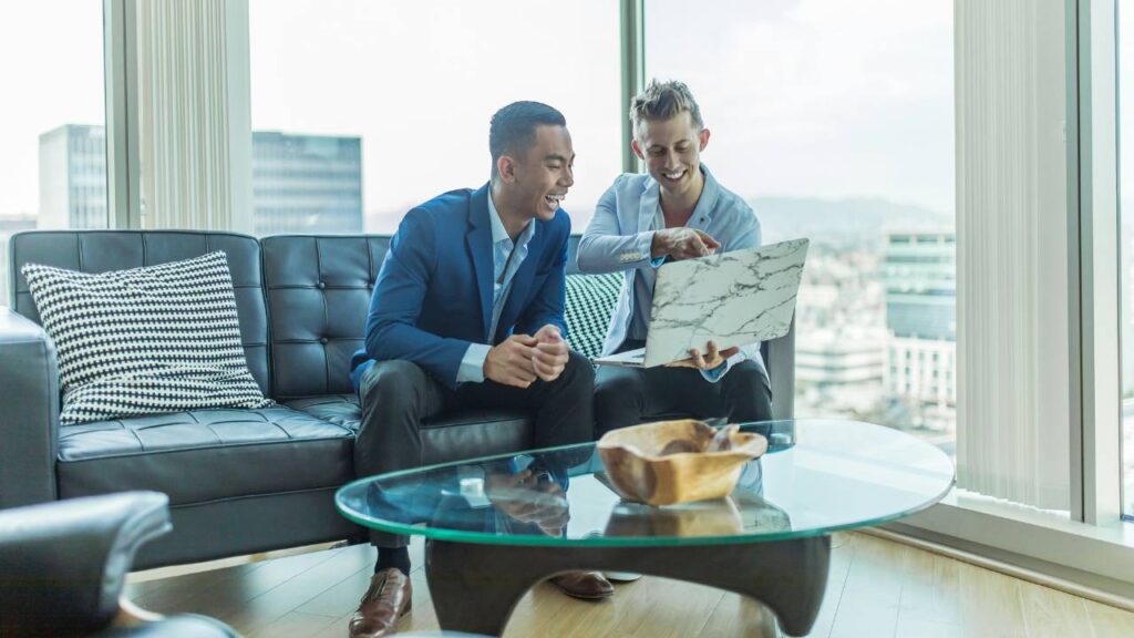 A photo of two young entrepreneurs having a laugh 